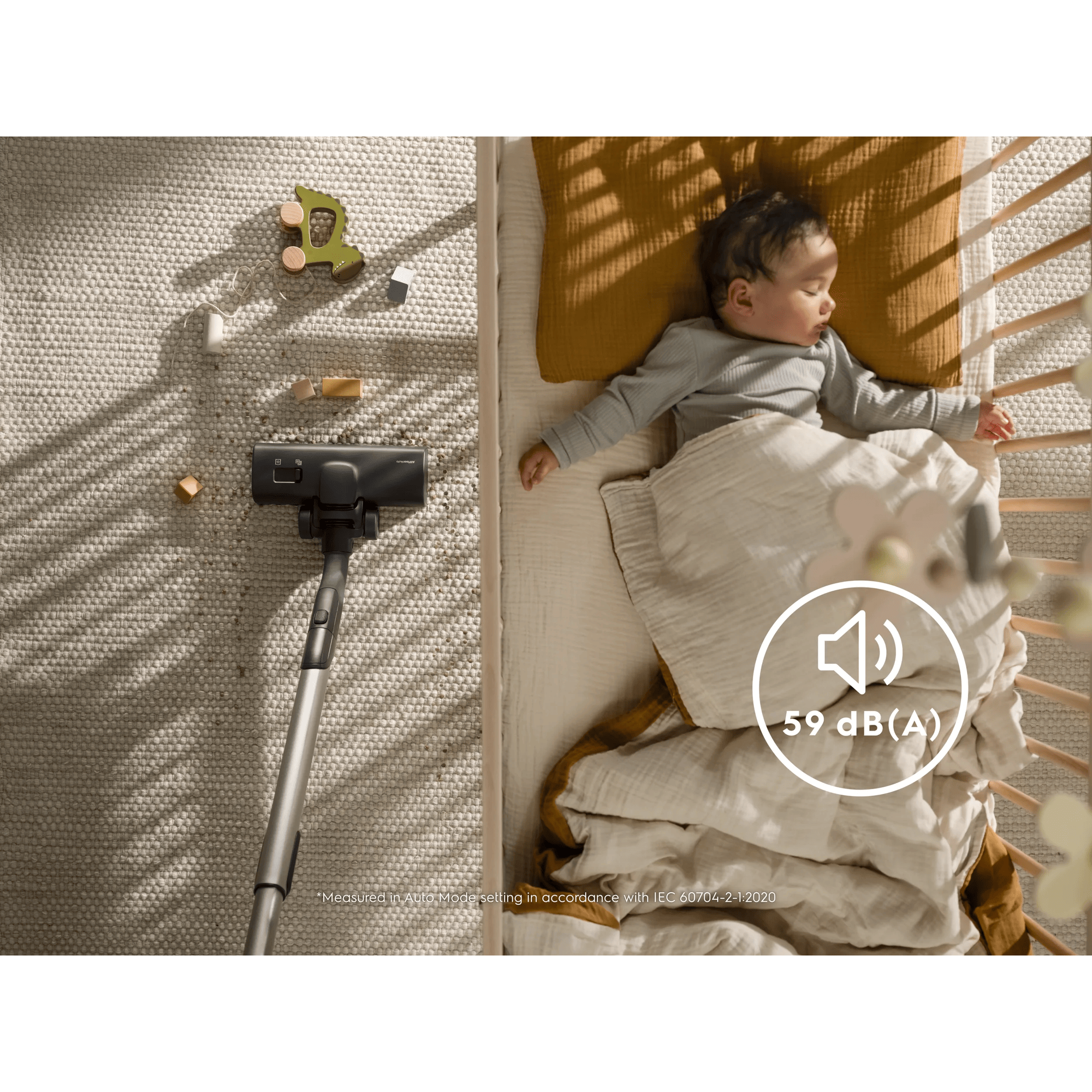 Zenza vacuum cleaner vacuums next to sleeping baby in crib