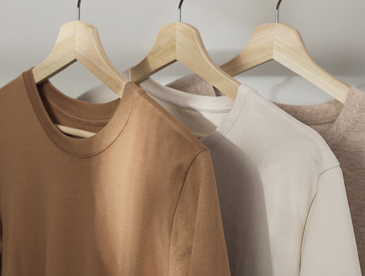 three sweatshirts on a hanger