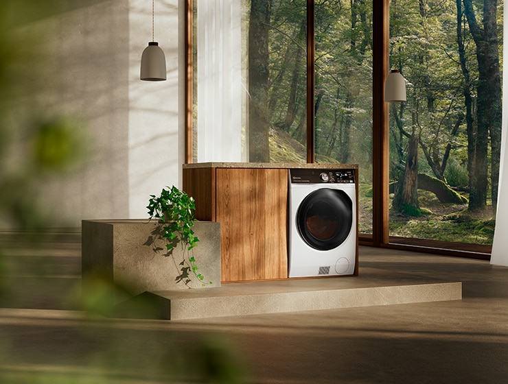 Washing machine in a room with large window at the back