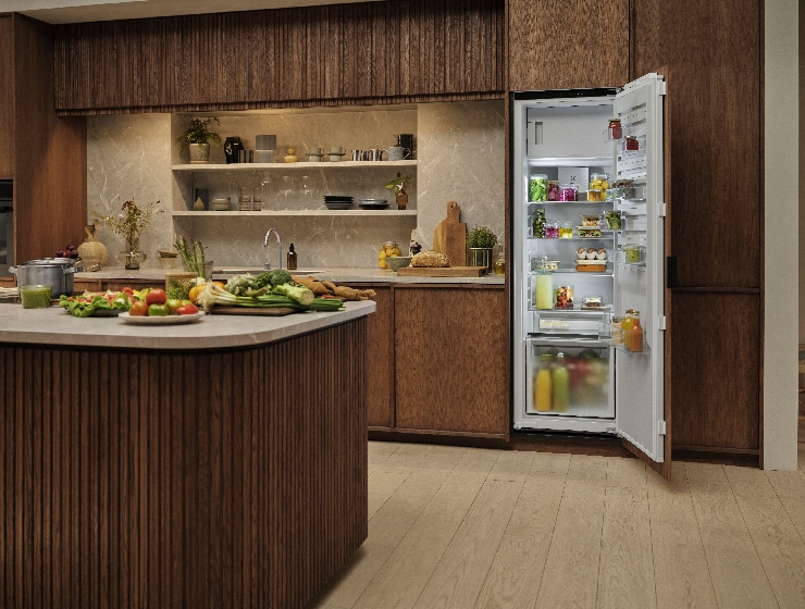 Kitchen view with open fridge in the back