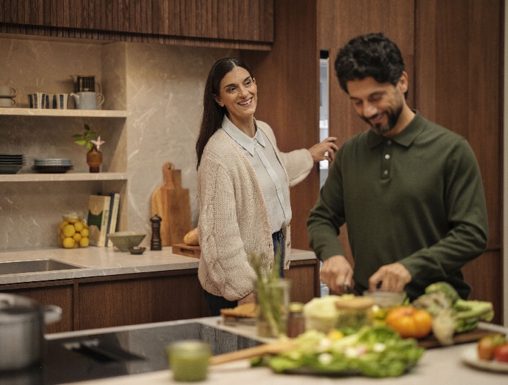 Man and woman standing in kitchen