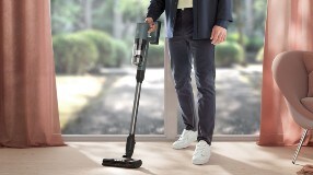 Man vacuuming carpet